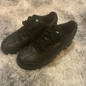 Puma Black and Gold Sneakers